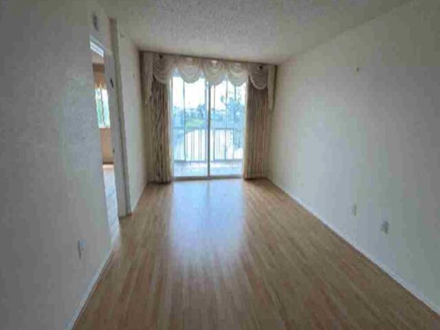 Photo of 9563 WELDON Circle #D311, Tamarac, FL 33321 (MLS # B26058220)