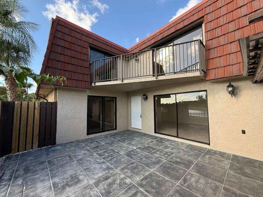Beautiful corner-unit townhouse in Boca Raton offered at $387,000 featuring 3 bedrooms, 2.5 bathrooms, and 1,589 SqFt of living space. This nicely updated home offers a bright open floor plan with abundant natural light, renovated interior, and stainless steel appliances. Enjoy peaceful lake views from the private patio and balcony, perfect for relaxing or entertaining. Brand-new A/C installed in June 2025 and roof replaced in 2025. Assigned parking space #147. Monthly HOA is $388. Special assessment of $150/month with approximate remaining balance of $12,285 to be assumed by buyer. HOA does not allow rentals during the first year of ownership. Conveniently located close to shopping, dining,