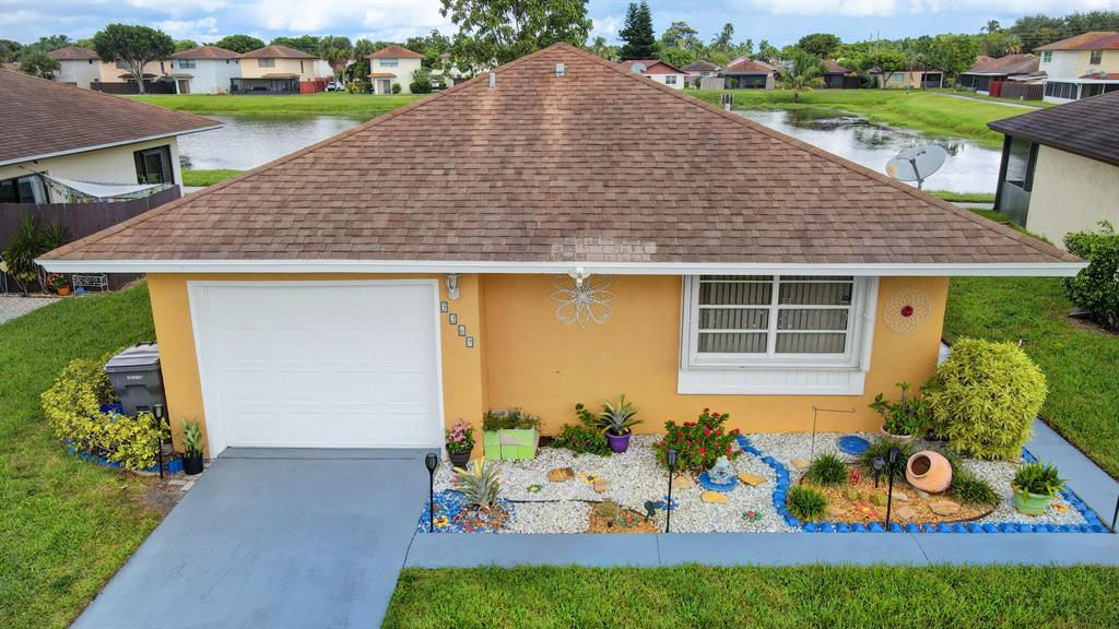 Come and see this lovely two-bedroom, two-bathroom house that includes a 1 car garage. This charming home features an updated kitchen with a cozy breakfast nook as well as bright and open living areas with plenty of room to unwind or entertain guests. The interior and exterior of the house have been freshly painted, and the baseboards and tile have been upgraded throughout the home. The 2 spacious bedrooms in the home include walk-in closets. Sit back, relax and enjoy your mornings and peaceful nights with the beautiful lake view from the enclosed patio. This community is also very well maintained and includes amenities such as pool and tennis. Low HOA!