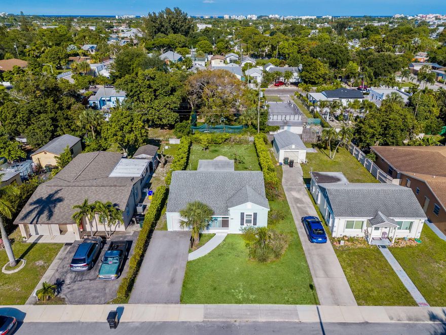 Just minutes from the beach and downtown Lake Worth Beach, this beautifully remodeled cottage has the kind of charm and warmth everyone loves. Inside, you'll find gorgeous high end luxury vinyl plank flooring, a bright updated kitchen with granite countertops, custom cabinetry, and upgraded plumbing and electrical. Outside feels like your own tropical retreat with a new entertaining deck, lush fenced yard, fruit trees, irrigation system, and privacy hedges. Take full advantage of all the heavy lifting already being done for you that includes hurricane impact windows, newer roof, updated light fixtures, designer inspired paint, exterior paint, and so much more!  Excellent airbnb and investment potential. Schedule your private showing today!