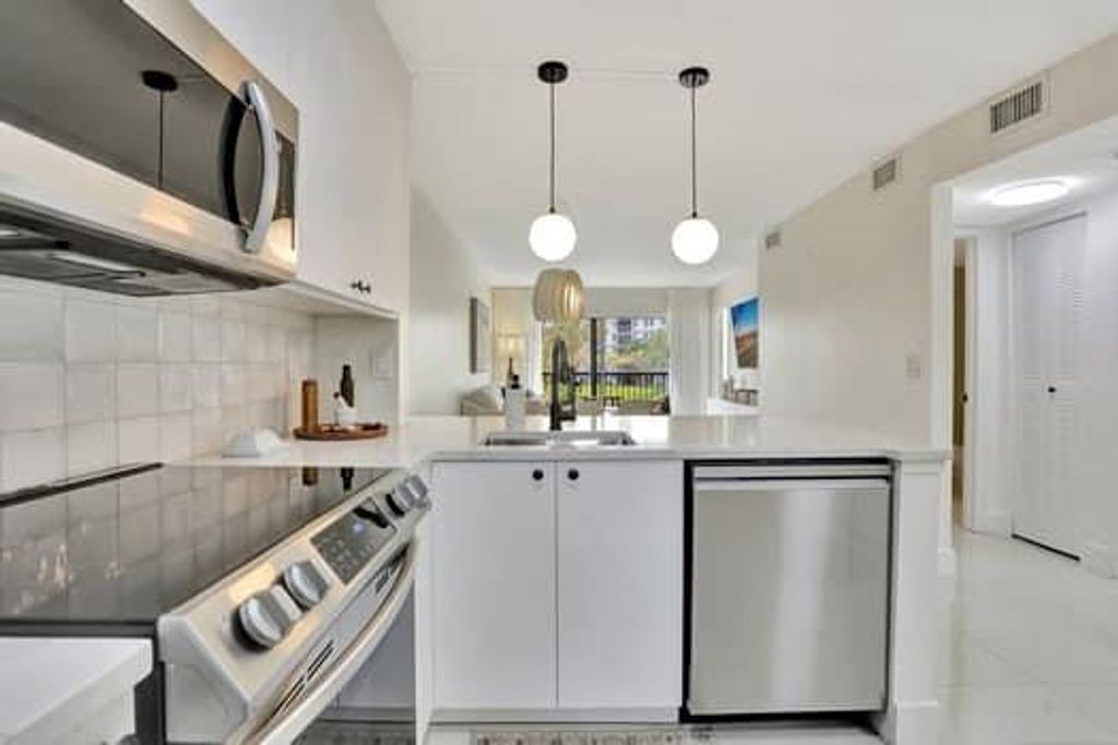 Photo of 2228 N Cypress Bend Drive #210, Pompano Beach, FL 33069 (MLS # F10498961)