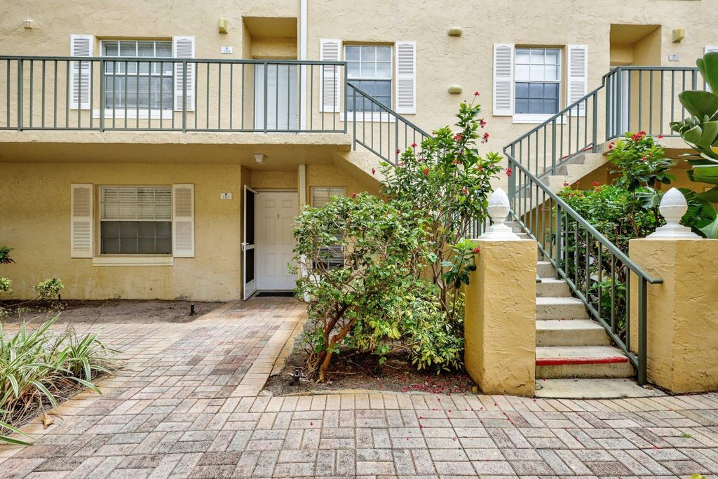 Photo of 1015 Lake Shore Drive #203, Lake Park, FL 33403 (MLS # R10987800)