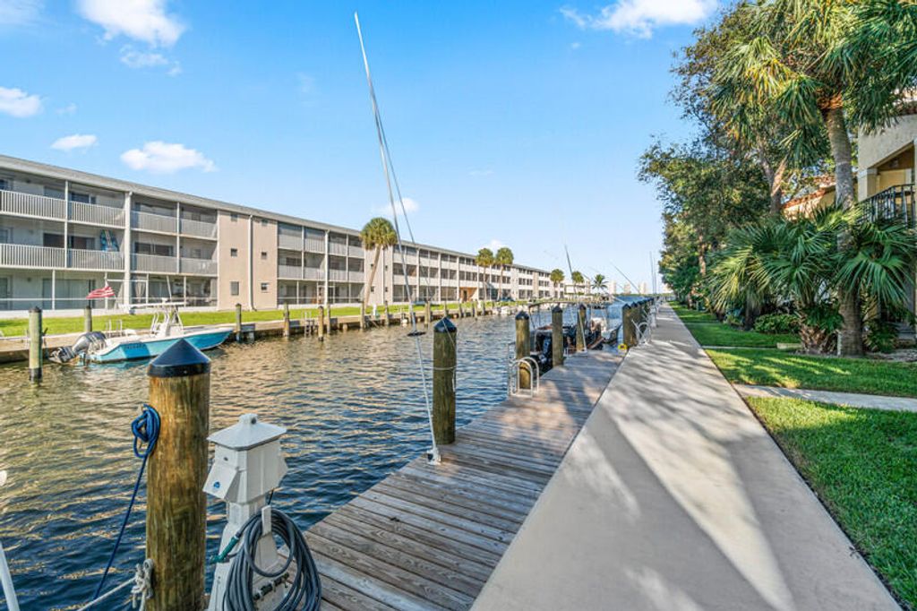 Photo of 1015 Lake Shore Drive #203, Lake Park, FL 33403 (MLS # R10987800)