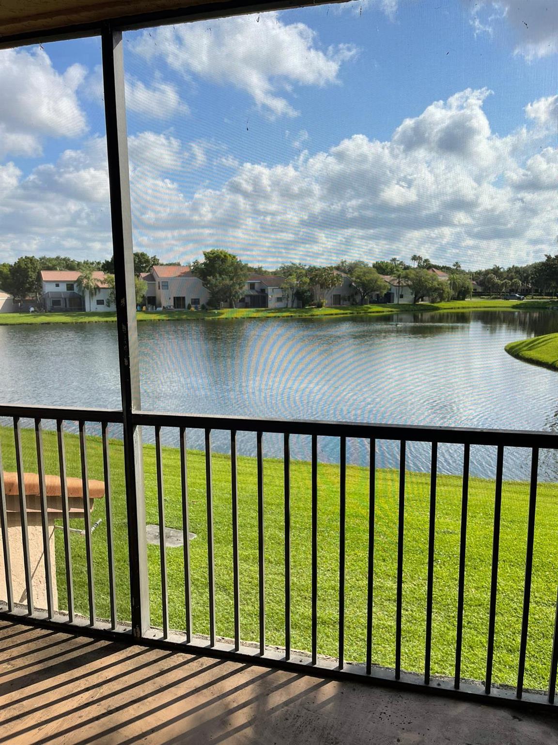 OPTIMA VILLAGE/FOUNTAIN SPRING..... Beautiful Lakefront views from this 2 Bedroom, 2 Bath, ceramic tile and wood veneer floors, full size washer and dryer in the unit, split floor plan, ceiling fans in all rooms including the screened in patio. 1 assigned parking space +ample guest parking! Walking distance to Deicke Park. Park offers tennis, volleyball, trail walk and more.