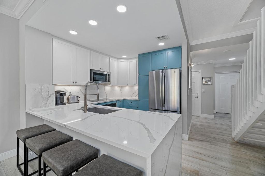 Photo of 11775 Saint Andrews Place #103, Wellington, FL 33414 (MLS # R11136498)