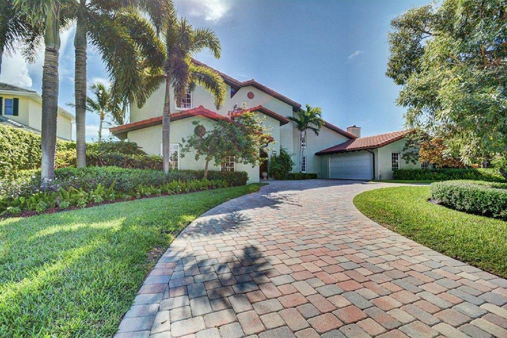 Bring the boat! This stunning 2 story 5 bedroom 4.5 bathroom 3.5 car garage waterfront and pool home is located directly on the wide water of the Intracoastal with fast easy no fixed bridge access to Palm Beach inlet, is a boat lovers paradise.Master suite offers an amazing master bath with granite counters, wood cabinets, roman tub with spa jets, two-person walk-in separate shower with spa shower heads & seamless glass door, two large walk-in closets with built-in cabinets. A recent renovation included a triple-layered roof, new electric, plumbing, AC units, pool & spa, 110-volt copper landscape lighting and PGT impact windows and doors on 75% of the home. Concrete boat dock with 12,000lb Hi-Tide lift resurfaced in late 2019.