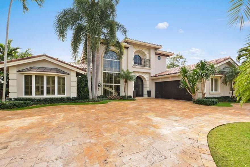 Updated in 2014, this stunning home sits on one of the best lots in Royal Palm Yacht & Country Club. Located on the corner of the grand canal, with southern exposure overlooking the newly renovated yacht club. The large patio features a gazebo with a summer kitchen and bar. The pool has a floral mosaic tile. Cement dock has both power and water. Whole house 70 kilowatt generator with a 500 gallon underground propane tank. https://youtu.be/TEOeEpB31LY