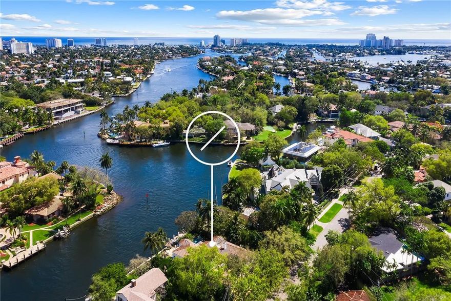 "Villa Vista" sits grandly where the New River & the Tarpon River converge providing EPIC panoramic views along its 100' of river frontage. Mediterranean-style estate built in 1926 was substantially renovated in 1989. Cathedral wood beamed ceilings welcome you to the living areas w/gorgeous keystone fireplace, wood floors, french doors opening to private courtyards and patios. Kitchen updated by current owner offers top-of-the-line appliances including gas cooktop. Master suite w/sitting area encompasses second floor & overlooks the river & pool w/private balcony to enjoy the glorious boat parade! Office & 3 bedrooms (one ensuite) on the first floor, w/powder room, large laundry room, generous storage areas & a two car garage with high ceilings. It's a pleasure to show this classic estate!