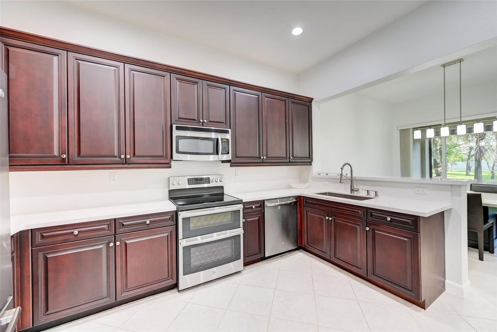 Photo of 5937 NW 117th Drive, Coral Springs, FL 33076 (MLS # F10409968)