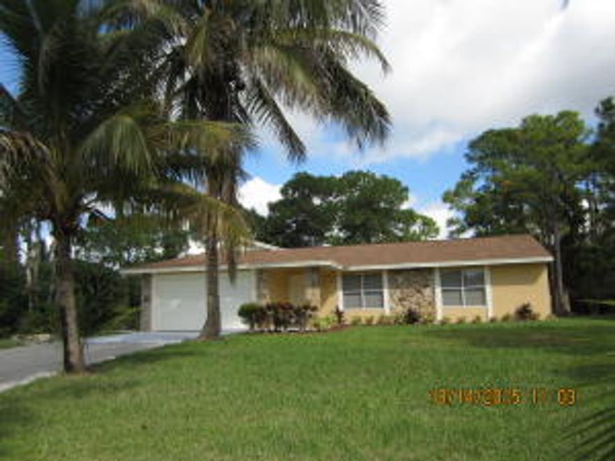 3/2 Single Family.  Completely renovated 3/2 single family home in Loxahatchee!  Brand new kitchen with gorgeous cabinets, granite counters and stainless steel appliances.  Remodeled bathrooms with new vanities, granite counters and beautiful tile. Brand new carpeting.  Walk-in-closets in all bedrooms.  Freshly painted inside and out.  Very light and bright. Large 2 car garage with new garage door.  Fantastic lot with beautiful, mature trees on a very private street. Do not miss this home at this price!