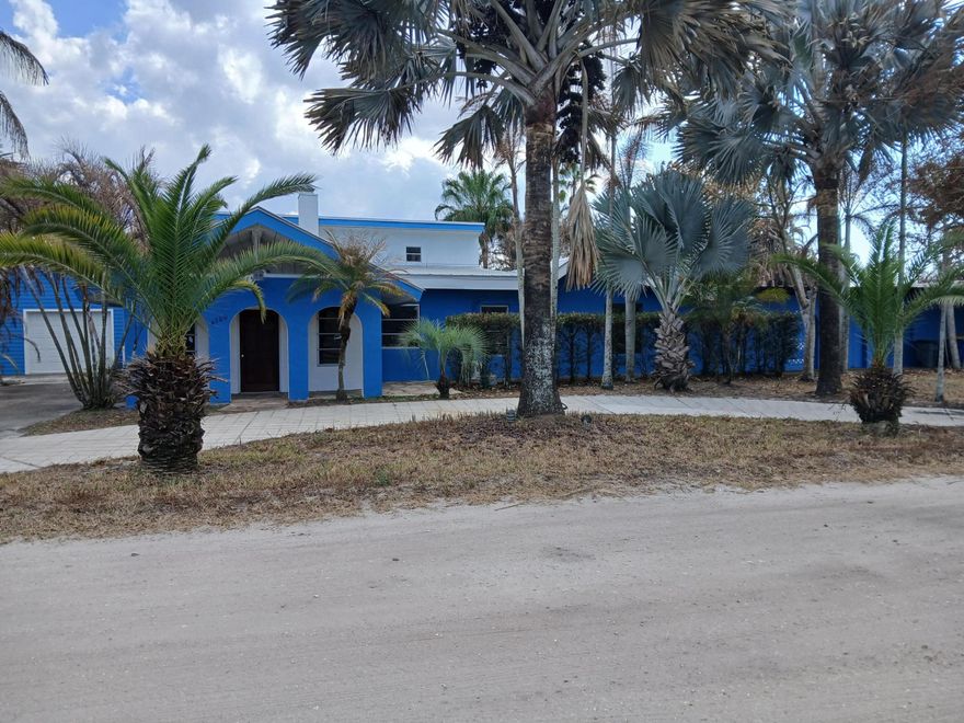 One-of-a-kind 5-acre jewel in desirable Palm City Farms, NO HOA! 3,602-sf CBS with METAL roof over all. Detached 900-sf 4+ car garage. Enjoy family time in your 40x20 enormous swimming pool with giant patio! Main house 2,802-sf, 4br/3ba, tall 14ft wood ceilings, breathtaking stone fireplace, spacious master bedroom with updated master bath, spacious kitchen with high-end brand-new stainless-steel kitchen appliances and lots of storage. New salt-water pool pump, updated well-water system, new water heater, and fresh interior-exterior & pool patio paint. 800-sf Guest house has 1br/1ba. 4-acre cross-fenced back pasture with 2-gated entrances. Over 200 palm trees. Add a pole barn, bring all your toys. Furniture negotiable. Enjoy a private locat ion while still close to shopping, dining, I-95, A-rated schools!