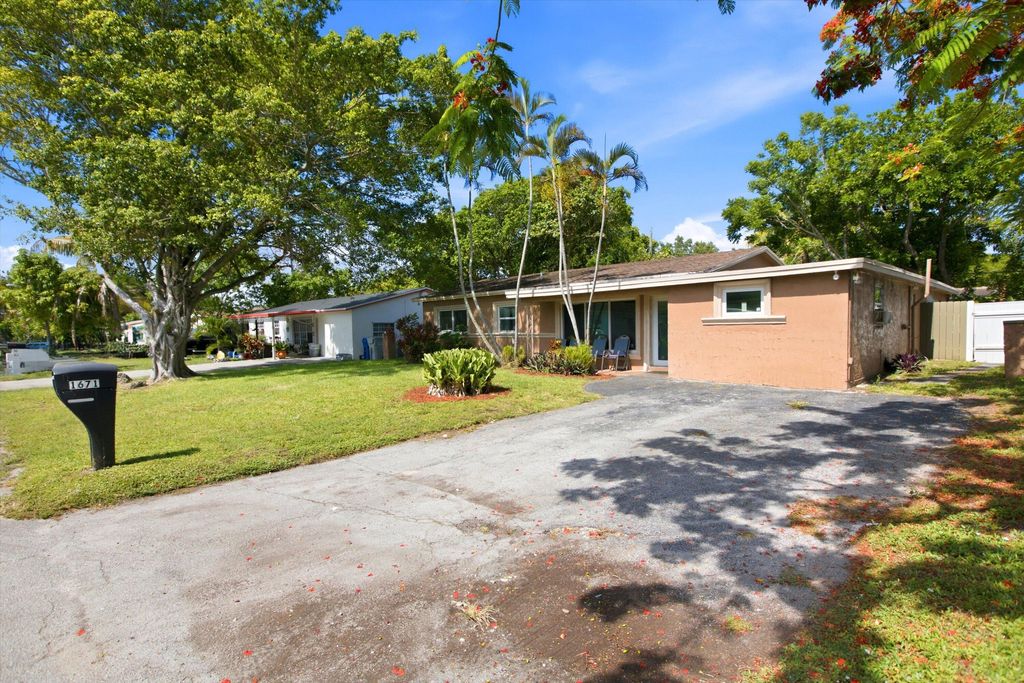 Photo of 1671 N Cypress Road, Pompano Beach, FL 33060 (MLS # B26042045)