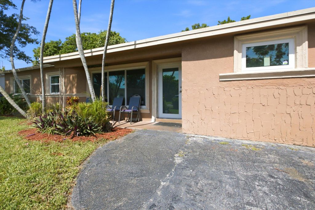 Photo of 1671 N Cypress Road, Pompano Beach, FL 33060 (MLS # B26042045)