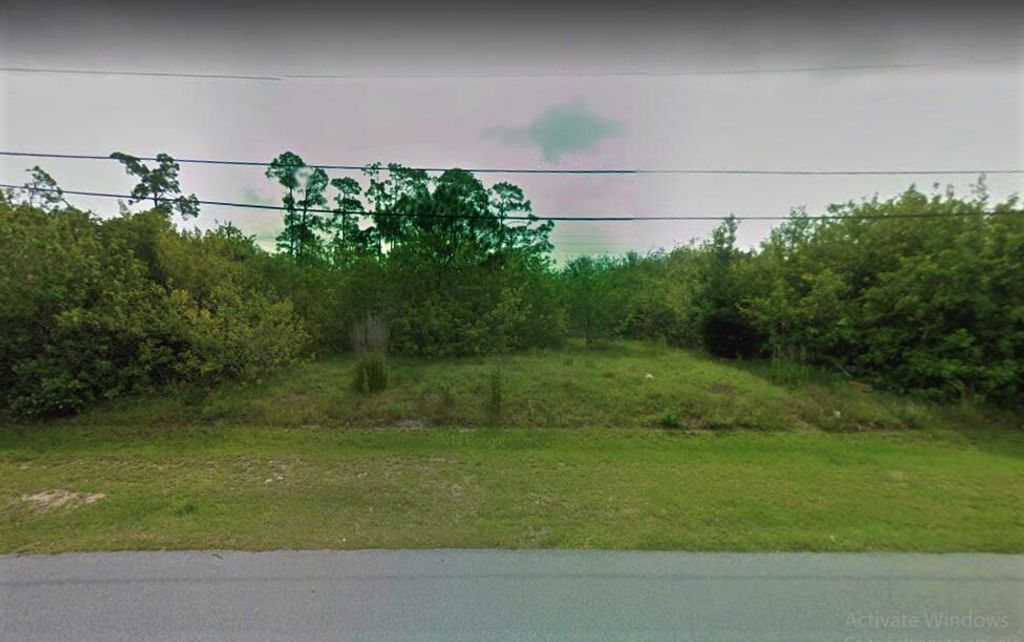 Photo of 6143 NW Gatun Drive, Port Saint Lucie, FL 34986 (MLS # R10745120)