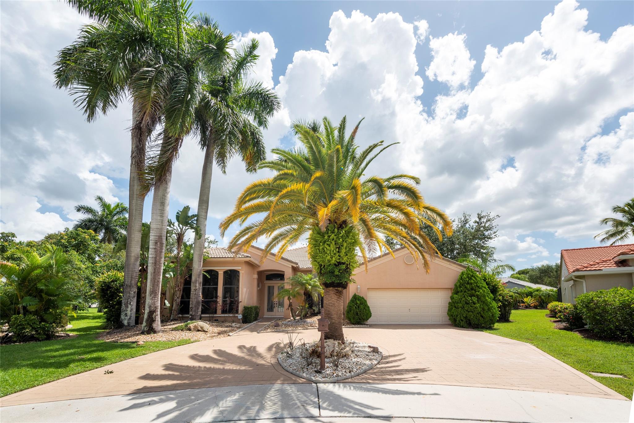 Run to this luxurious one-story home on a cul-de-sac in the beautiful guard gated The Lakes. Newly high-end remodelled open kitchen and all new bathrooms. Oversized waterfront lot in the heart of highly sought-after Weston. With easy access to Ft. Lauderdale’s beautiful beaches in just 25 minutes, it’s the perfect balance of sophistication with serenity. Spacious living, dining, kitchen & family rooms with 12 ft finished ceilings, stone floors throughout social areas, open to large relaxing lanai with covered pergola perfect for entertaining. Large master suite with walk-in closets & built-ins. Expansive lawn, saltwater pool & waterfall tranquility jacuzzi. Open kitchen overlooking pool & lake featuring quartz counter tops, stainless steel appliances & wood cabinets. Attached 2 car garage.