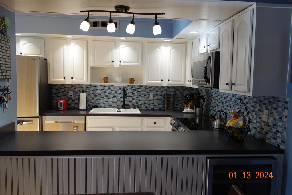 Photo of 7 Atrium Circle #B, Atlantis, FL 33462 (MLS # R10950111)