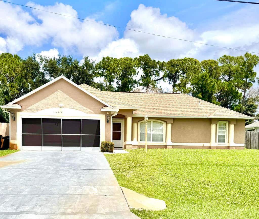 Photo of 1497 SW Wepaco Avenue, Port Saint Lucie, FL 34953 (MLS # B26061689)