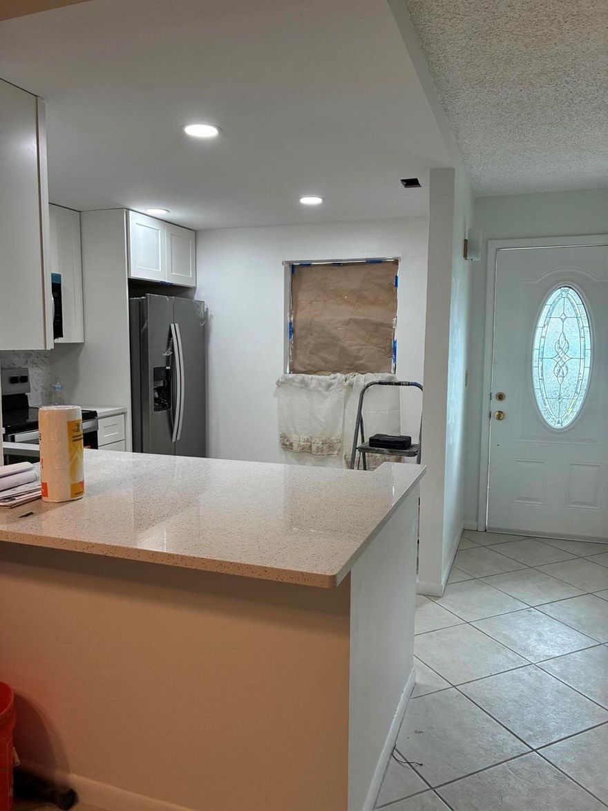 This beautifully renovated unit in an active 55+ community can be your new home.New baths, kitchen, appliances and New Hurricane sliding door to your Paver Patio.Vacant on combo lockbox.  Showings can begin after Thanksgiving.Or call Listing agent if need access with well qualified prospective tenant