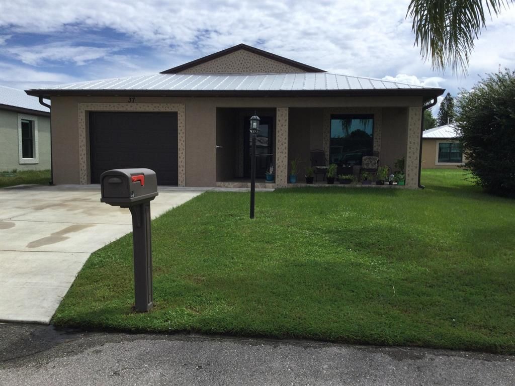 Photo of 37 Monterey Way, Port St Lucie, FL 34952 (MLS # R10832784)