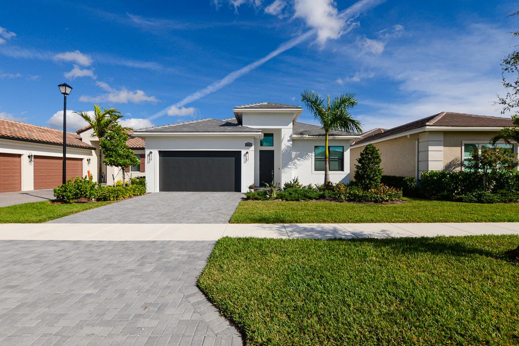 Photo of 9482 SW Pepoli Way, Port Saint Lucie, FL 34987 (MLS # R10941133)