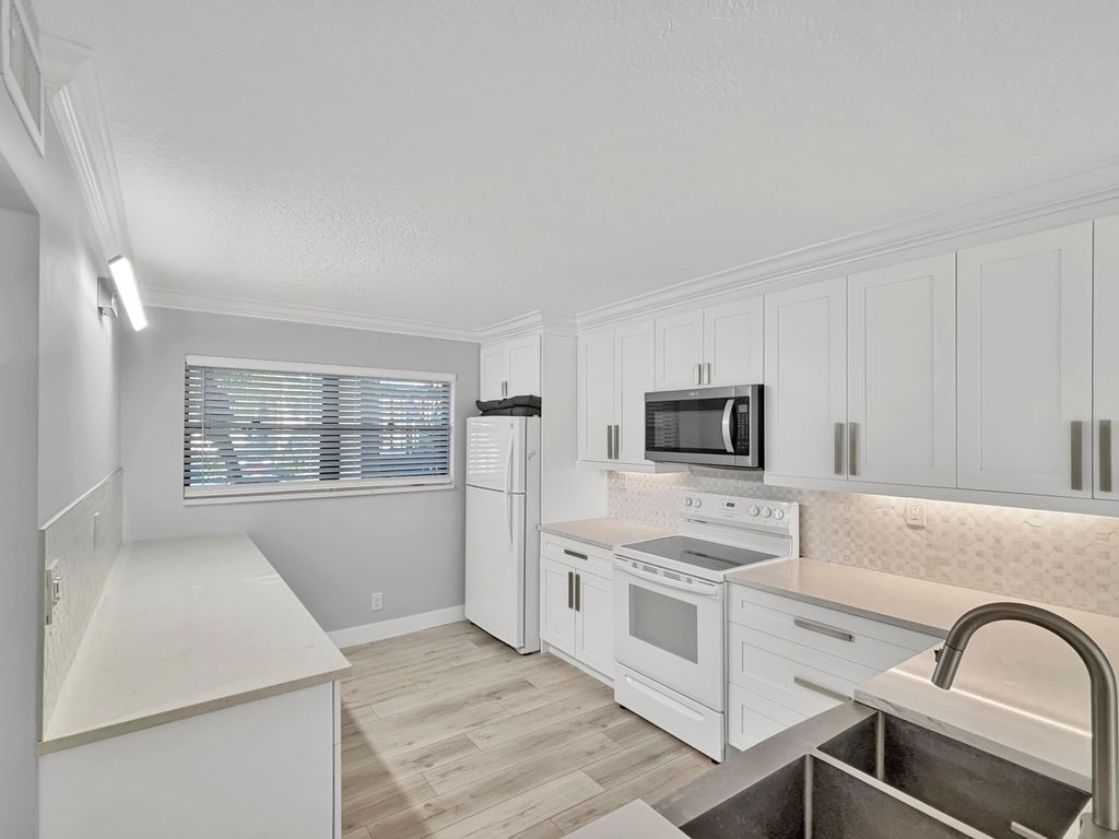 Photo of 13403 Touchstone Place #A102, Palm Beach Gardens, FL 33418 (MLS # B26005912)