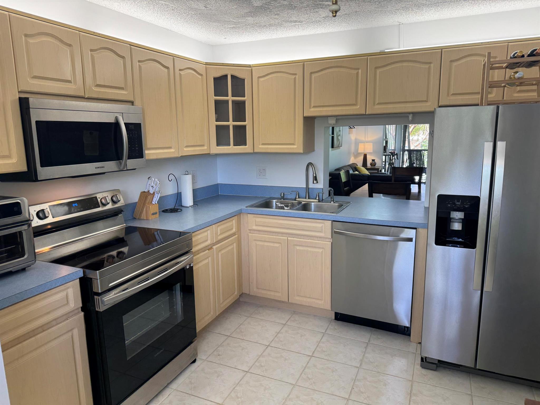 MOTIVATED SELLER! Renovated 2 Bed 2 Bath condo. Bright & spacious second floor unit in sought-after Township Community. Great community amenities! Lovely garden view from patio. ALL AGES. Kitchen features full size stackable washer & dryer, new stainless steel appliances. Screened in balcony. Premium vinyl and tile flooring throughout. Large walk in closet in primary bedroom. Monthly maintenance fee includes water, cable, maintenance & amenities. No pending assessments. No trucks or commercial vehicles. Plenty of guest parking! The Township Community is known for its incredible amenities, including a clubhouse with a gym, library, tennis courts, an Olympic-sized swimming pool, a theater, and more. Plus, Coconut Creek offers a free courtesy bus service for residents. Call today