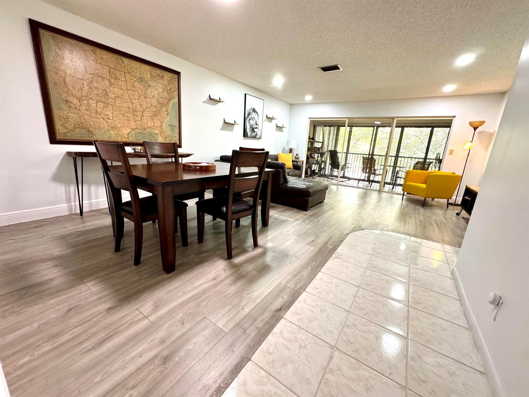PRICE ADJUSTMENT - MOTIVATED SELLER! Renovated 2 Bd 2Ba. Bright & spacious second floor unit in sought-after Township Community. Great community amenities! Lovely garden view from patio. ALL AGES. NO PENDING ASSESSMENTS. Kitchen features full size stackable washer & dryer, new stainless steel appliances. Screened in balcony. Premium vinyl and tile flooring throughout. Large walk in closet in primary bedroom. Monthly maintenance fee includes water, cable, maintenance & amenities. No trucks or commercial vehicles. Plenty of guest parking! The Township Community is known for its incredible amenities, including a clubhouse with a gym, library, tennis courts, an Olympic-sized swimming pool, a theater, and more. Plus, Coconut Creek offers a free courtesy bus service for residents.
