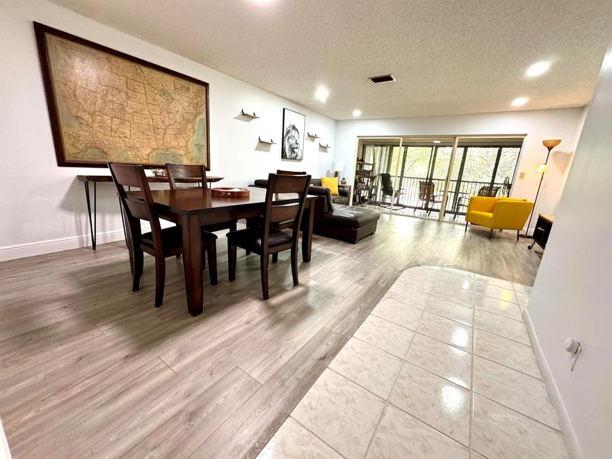 PRICE ADJUSTMENT - MOTIVATED SELLER! Renovated 2 Bd 2Ba. Bright & spacious second floor unit in sought-after Township Community. Great community amenities! Lovely garden view from patio. ALL AGES. NO PENDING ASSESSMENTS. Kitchen features full size stackable washer & dryer, new stainless steel appliances. Screened in balcony. Premium vinyl and tile flooring throughout. Large walk in closet in primary bedroom. Monthly maintenance fee includes water, cable, maintenance & amenities. No trucks or commercial vehicles. Plenty of guest parking! The Township Community is known for its incredible amenities, including a clubhouse with a gym, library, tennis courts, an Olympic-sized swimming pool, a theater, and more. Plus, Coconut Creek offers a free courtesy bus service for residents.
