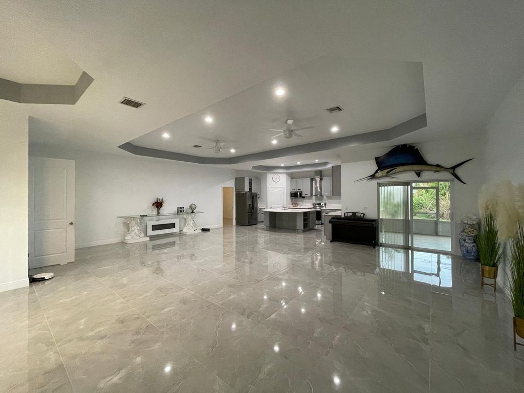 Photo of 1711 SE Airoso Blvd, Port Saint Lucie, FL 34984 (MLS # F10528395)