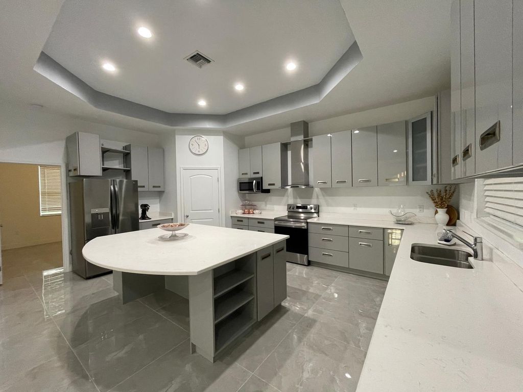 Photo of 1711 SE Airoso Blvd, Port Saint Lucie, FL 34984 (MLS # F10528395)