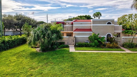 Photo of 3930 VILLAGE Drive #C, Delray Beach, FL 33445 (MLS # B26088228)