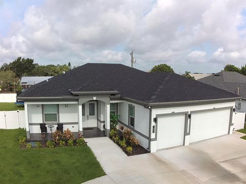 Photo of 1692 SW Paddock Street, Port Saint Lucie, FL 34987 (MLS # R11128699)