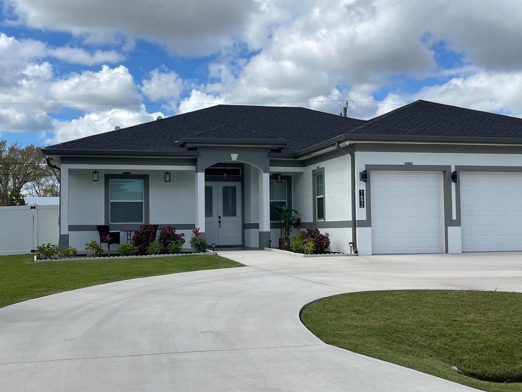 Photo of 1692 SW Paddock Street, Port Saint Lucie, FL 34987 (MLS # R11128699)