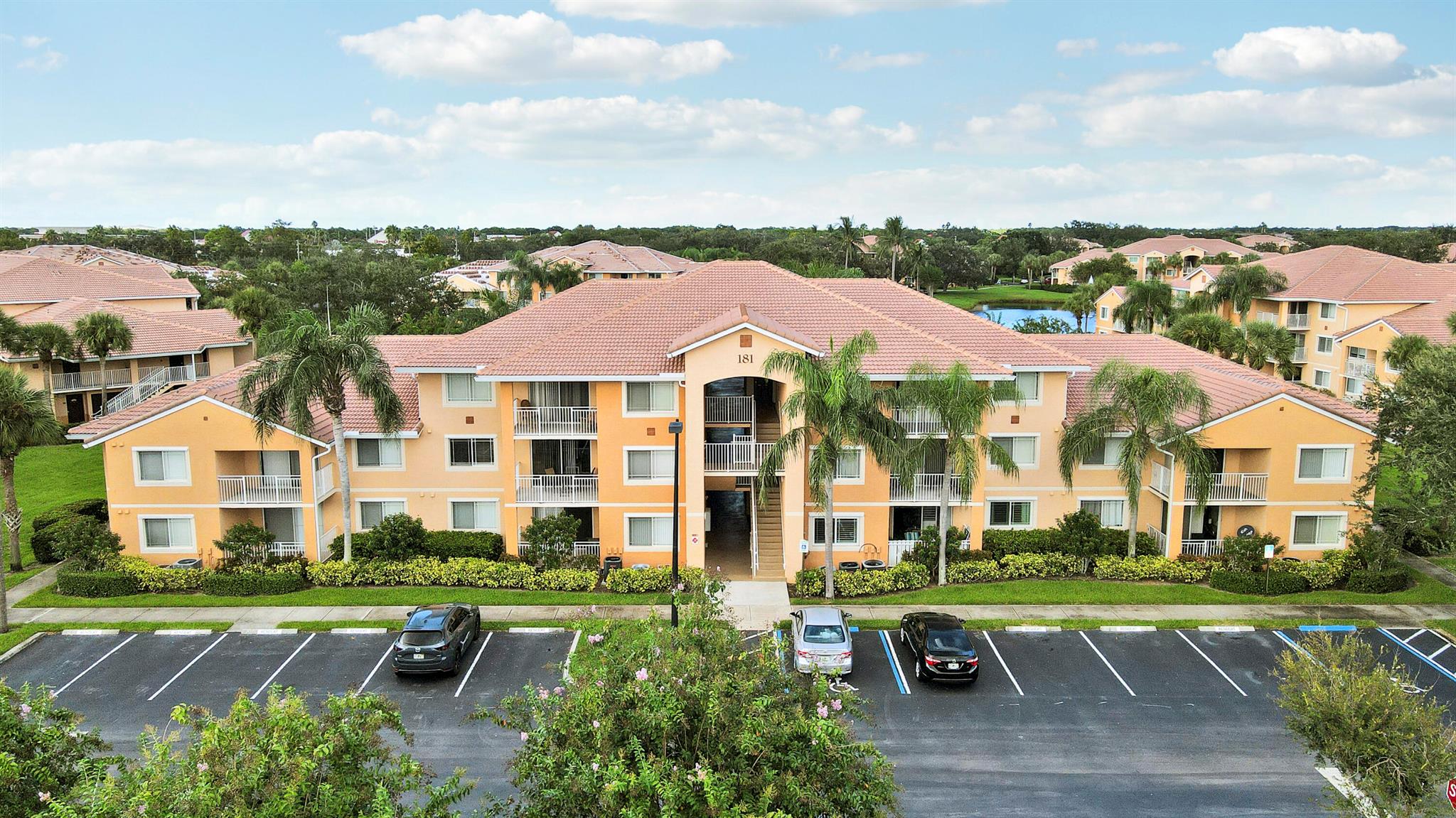 Welcome to The Club at St. Lucie West! This spacious 2 bedroom, 2 bath condo offers fresh paint, new vinyl flooring, soaring vaulted ceilings, and a serene lake view. The building has a new roof, adding peace of mind. Enjoy resort-style living with community amenities including a pool, fitness center, clubhouse, and more--all in the heart of St. Lucie West, close to shopping, dining, and I-95.
