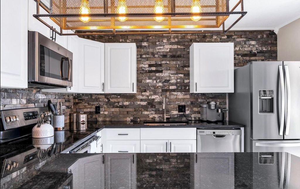 Photo of 3167 Gardens East Drive #A, Palm Beach Gardens, FL 33410 (MLS # R11087731)