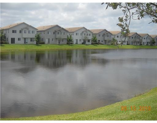 WOW-- Desirable two story townhome on the lake with 1 car garage. Private guard gated community with resort style amenities. Assoc dues includes cable , building insurance and resort style amenities. up to two pets allowed, per assoc no aggressive breeds. WELCOME HOME