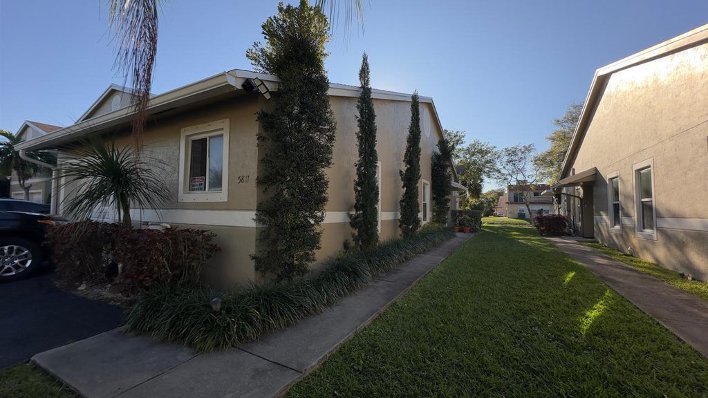 Photo of 5811 NW 57th Avenue, Tamarac, FL 33319 (MLS # B26079652)