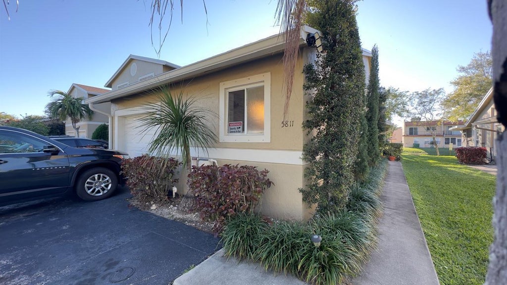 Photo of 5811 NW 57th Avenue, Tamarac, FL 33319 (MLS # B26079652)