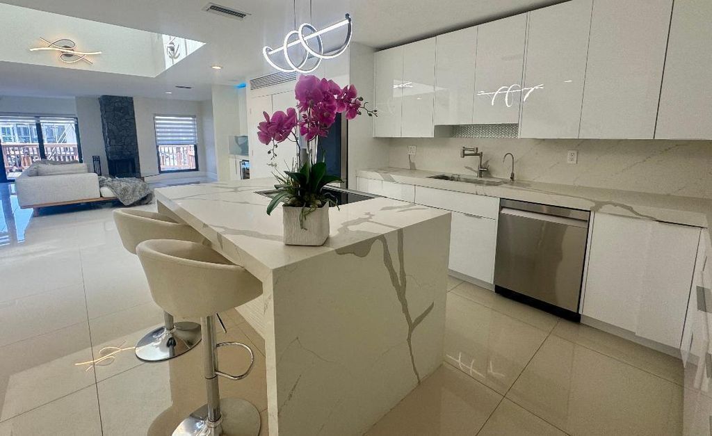 Photo of 1127 Boca Cove Lane, Highland Beach, FL 33487 (MLS # B26008459)