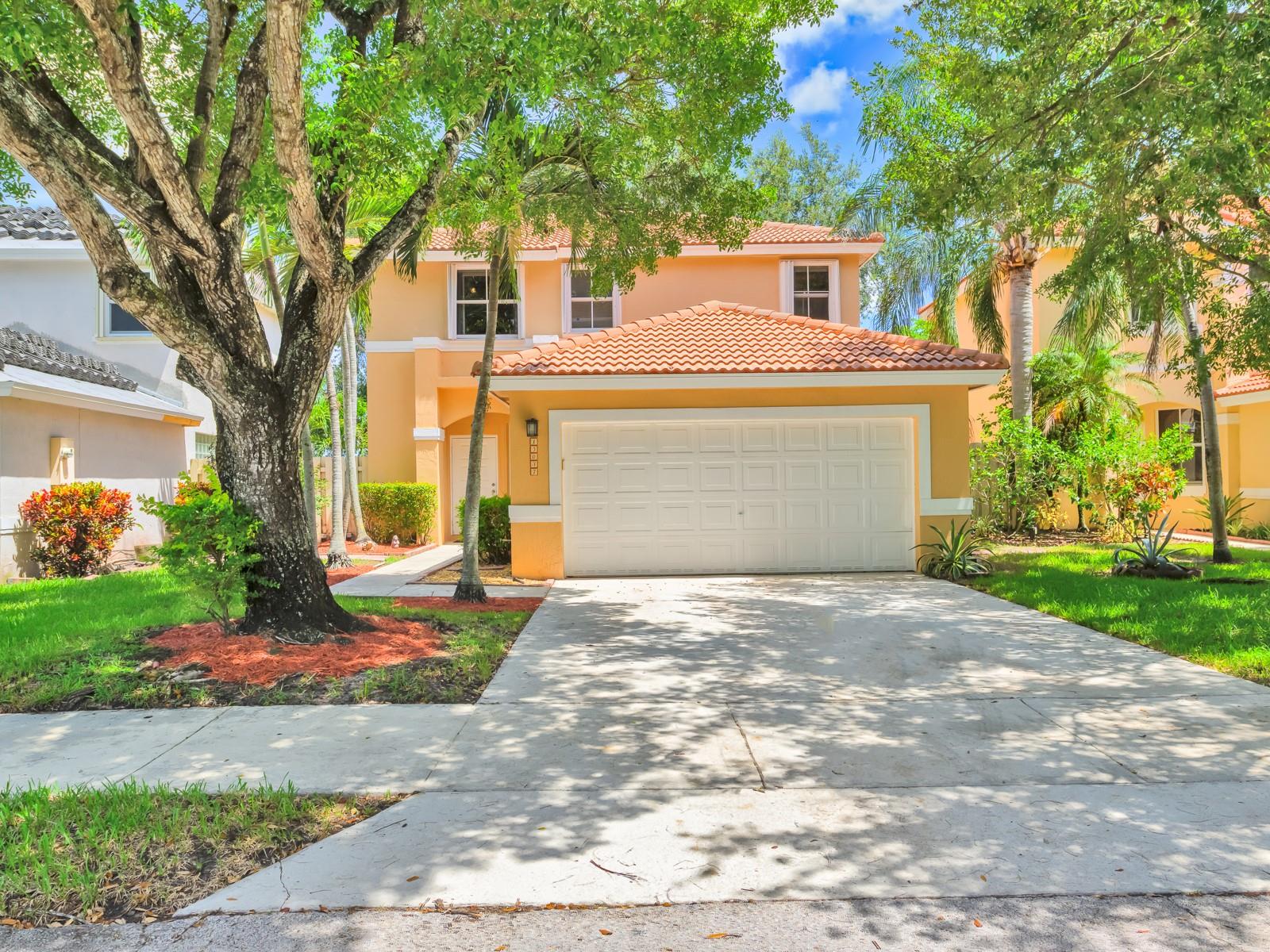 Welcome to this beautiful 3-bedroom, 2.5-bath single-family home with a 2-car garage, ideally located in a desirable gated community in Davie. Bright and inviting interior with tile & laminate flooring throughout and fresh interior paint. The kitchen features sleek stainless steel appliances, while the renovated bathroom adds a modern touch. Newer A/C unit (2023) equipped with a Nest thermostat, and accordion hurricane shutters. Relax in the private, fenced backyard with no rear neighbors, perfect for outdoor entertaining. The community offers fantastic amenities, including a pool, playground/park, all with a low HOA. Located near top-rated schools, I-75, shopping, dining & more. This home is the perfect blend of comfort, convenience & lifestyle. Schedule your private showing today!
