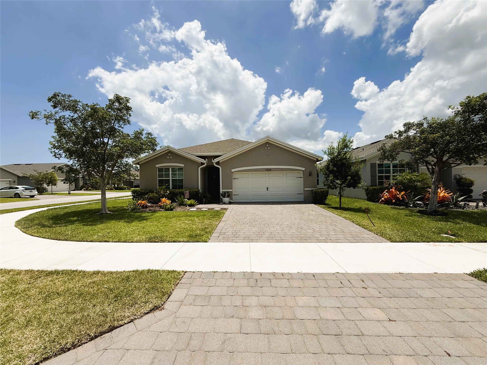 Welcome to this stunning 2021-built 4-bedroom, 2-bath home nestled in the sought-after gated Seawalk community. Featuring a spacious 2-car garage with sleek epoxy flooring, this residence combines fresh, contemporary design with unbeatable convenience. Enjoy an open-concept layout perfect for entertaining, plus a private backyard retreat. Stroll just minutes to charming Downtown Jensen Beach, where local restaurants, boutique shops, bars, and ice cream spots evoke a classic beach town vibe. Zoned for top-rated Martin County schools. Only minutes from the beach—grab your surfboard or sunset blanket! Whether you’re chasing waves or craving walkable coastal charm, this home delivers the perfect blend of comfort, style, and location.