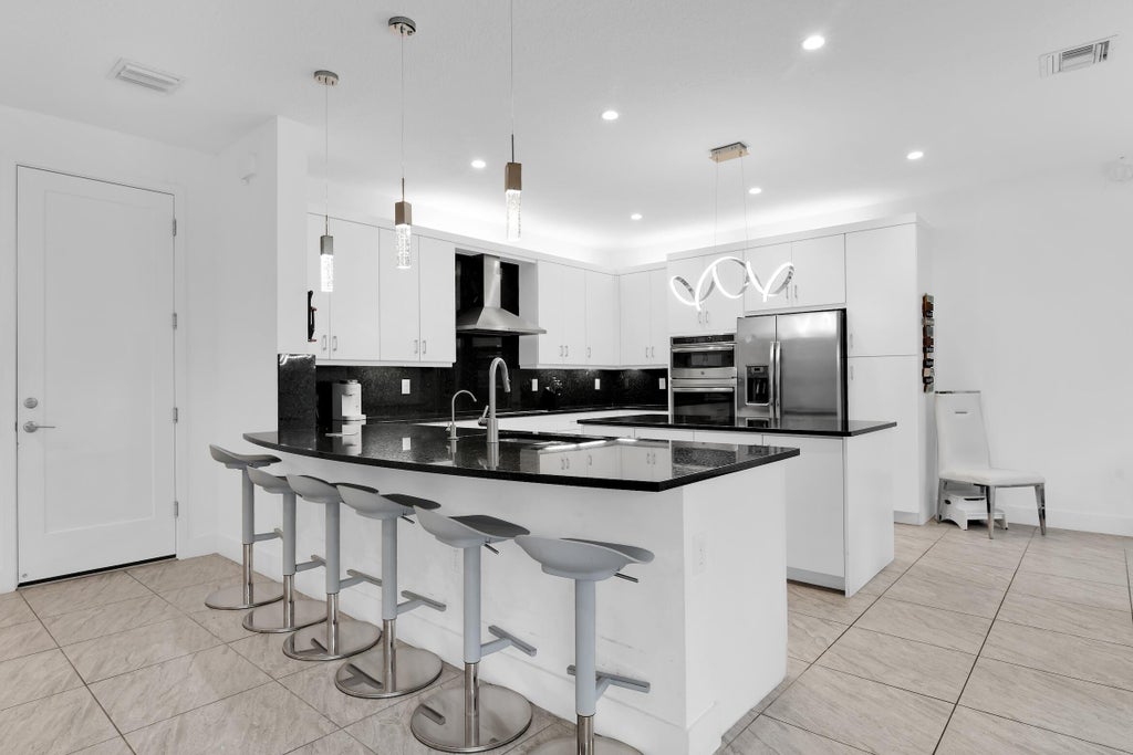 Photo of 9815 Steamboat Springs Circle, Delray Beach, FL 33446 (MLS # B26092361)