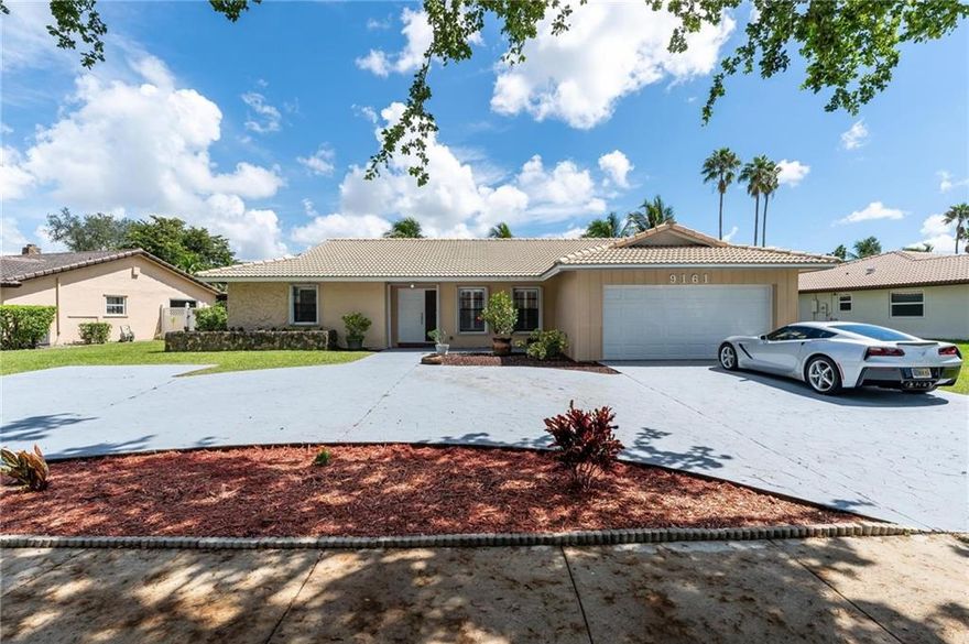 This gorgeous centrally located, Jacaranda Lakes 3/2 pool home is close to hospitals, shopping, schools, major roads and parks! Home sits on Tranquil canopied street in very desirable Jacaranda Lakes, a beautiful community in heart of Plantation! Huge stamped concrete circular driveway, plus matching stamped walkway. Vaulted ceilings, formal dining room, sweeping game/family room with cedar wall off kitchen and triple sliders to large 40’ covered back patio, cost-saving Lennox A/C Smart unit. An oversized master suite with private office, tiled cabana bathroom w/ roman tub/shower. 2 additional large bedrooms W/sizeable ‘bonus’ room with A/C. Separate laundry room W Generator port installed. Accordion shutters throughout patio + new hurricane-rated garage door. fenced back yard.