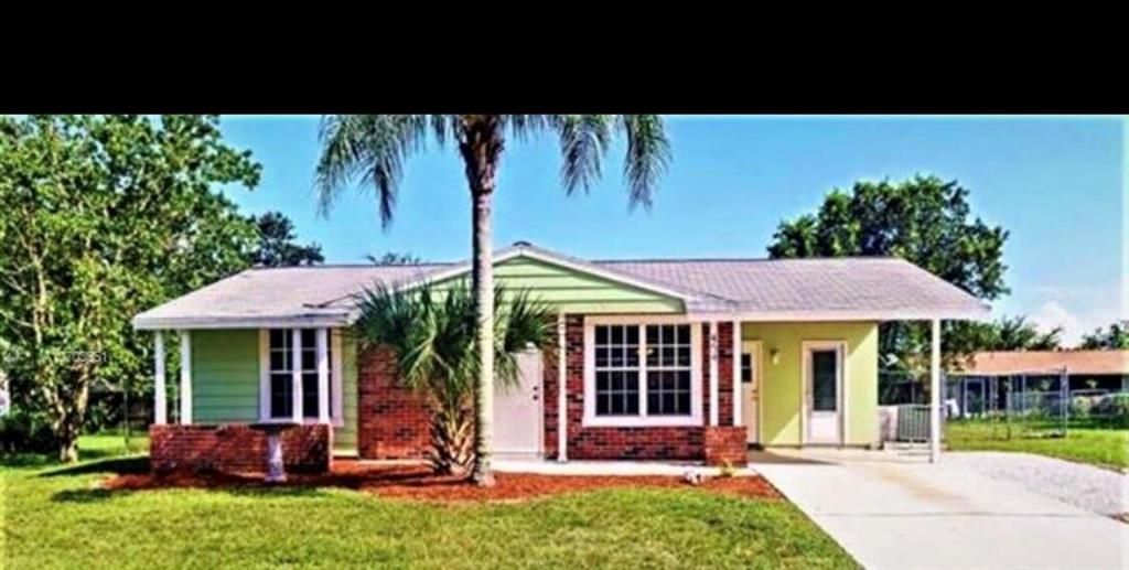 Photo of 454 NE Electra Avenue, Port Saint Lucie, FL 34983 (MLS # R10710046)