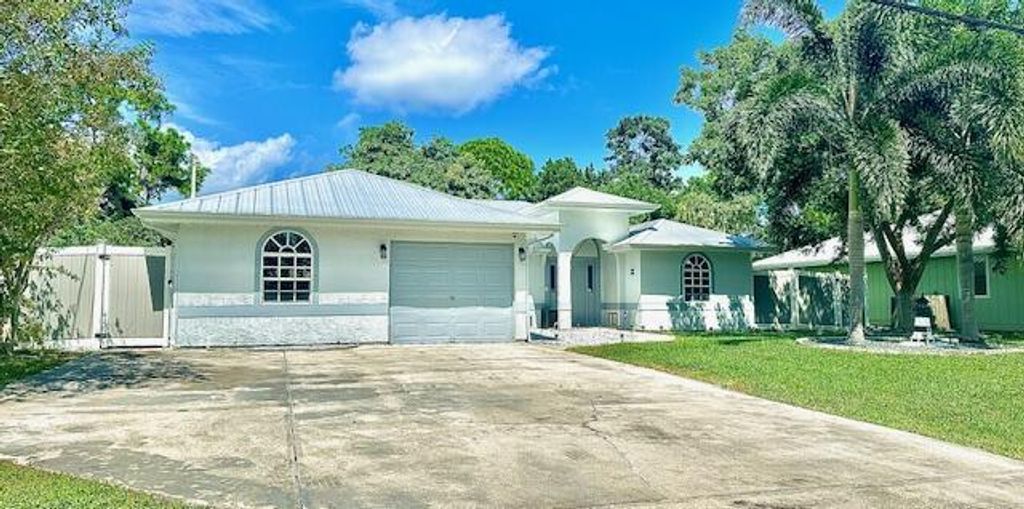 Photo of 2279 SE Blossom Road, Port Saint Lucie, FL 34952 (MLS # R11127311)