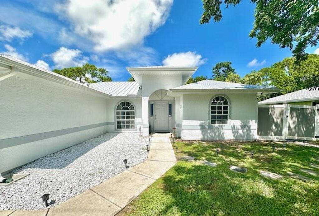 Photo of 2279 SE Blossom Road, Port Saint Lucie, FL 34952 (MLS # R11127311)