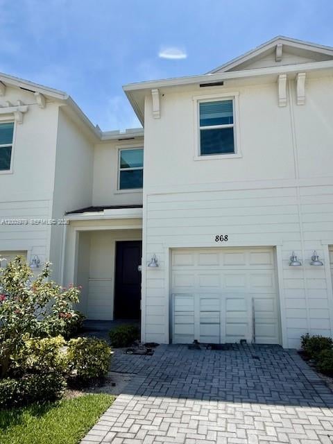 Photo of 868 SE Grovebush Lane, Port Saint Lucie, FL 34984 (MLS # A12003979)