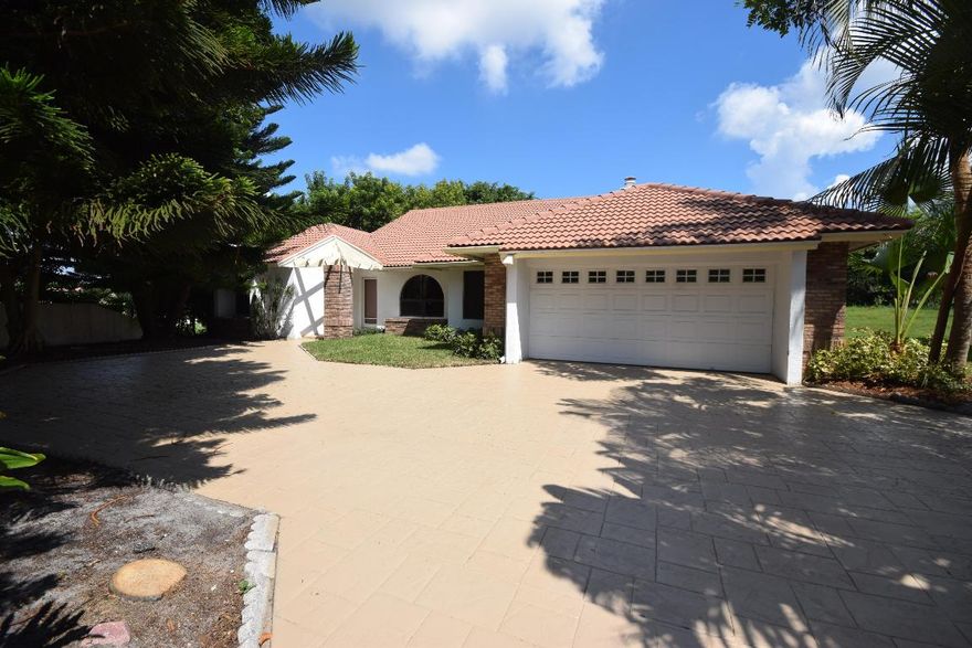 Nice 4BR/2.5BA home with a 2 car garage on a big corner lot in a desirable neighborhood and A rated schools. There is a new A/C, new pool pump in 2015, electric heater in pool & Jacuzzi and the roof was replaced in 2015. It has 4 large bedrooms, with the master overlooking the screened in pool and Jacuzzi. The master has a large bathroom with separate tub, shower and a bidet. One of the bedrooms is near the master that could be used as a bedroom or an office. On the other side of home is 2 large bedrooms and a bathroom with one room looking out to the pool and lanai. It has a good size eat-in kitchen looking onto the family room and the lanai with a dining room around the corner. Most rooms in the home look out to the pool so you always have a nice view. Great deal for under $500,000!!