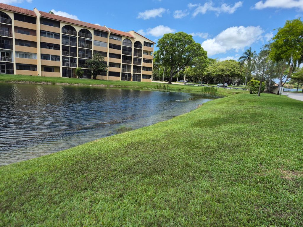 Photo of 10039 Winding Lake Road #202, Sunrise, FL 33351 (MLS # B26032395)
