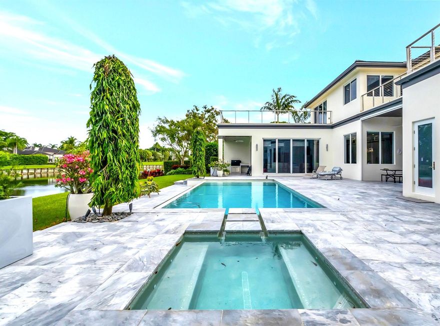 A fabulous opportunity to enjoy the vibrantly social St. Andrews Country Club. Custom crafted for ultra luxe living, this contemporary home was built in 2017. 6 bedroom & 7.3 bath estate overlooks magnificent lake & golf views. The home has been gently lived-in. Includes formal living & dining room, gourmet kitchen, large breakfast area, family room, home theater, game room & office. Exquisite owners suite offers generous closets & his & her baths. There is a resort style pool & spa, outdoor kitchen, generator & 4-bay garage. The home features impact windows & doors, quartz counters, center kitchen island, high end stainless steel appliances, hardwood floors throughout, elevator & a 700-bottle wine cooler. Lush landscaping completes this extremely private & exclusive retreat.